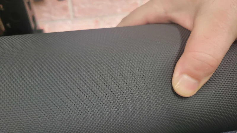 Our tester gets a feel for the texture and firmness of the REP Fitness 5000 Series Leg Roller Attachment