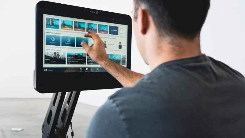 Coop checking out the programming on the CITYROW GO Max.