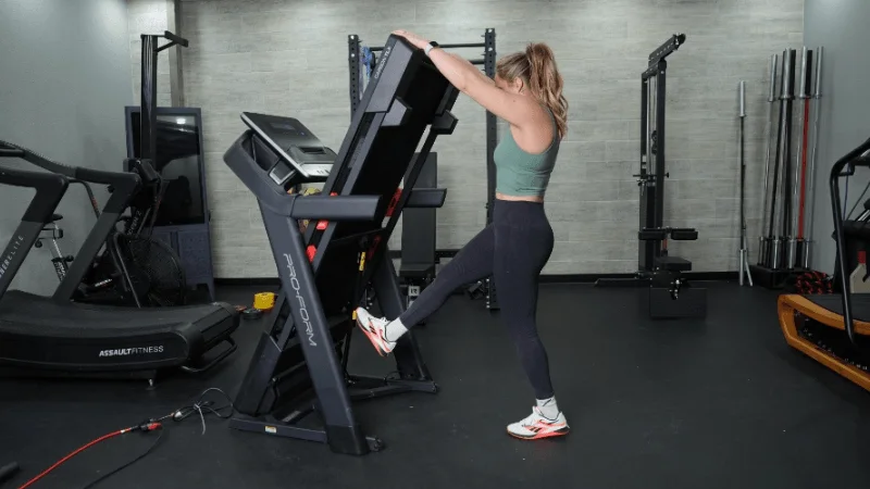 Our tester unfolding the ProForm Carbon TLX treadmill prior to a training session