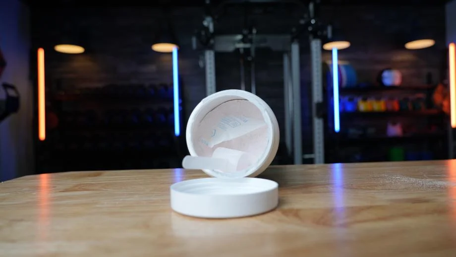 A container of Transparent Labs BULK on its side, exposing the scoop and powder within