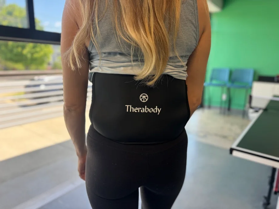 Rear view of a person wearing a Therabody Thermback LED
