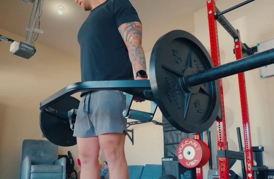 Our tester performing trap bar deadlifts with a set of The Strength Co. Olympic Iron Barbell Plates