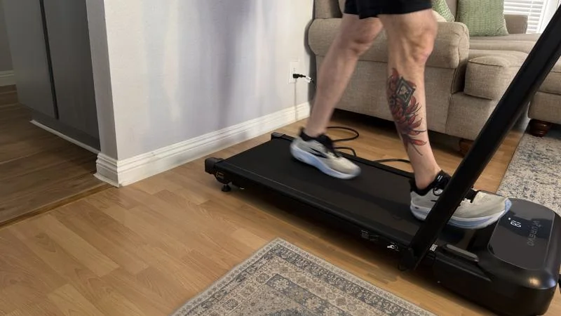 Our product tester walking on the Urevo FoldiMix 5L Smart Treadmill