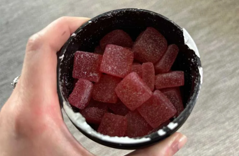 Looking down into an opened container of AXO Pre-Workout Gummies.