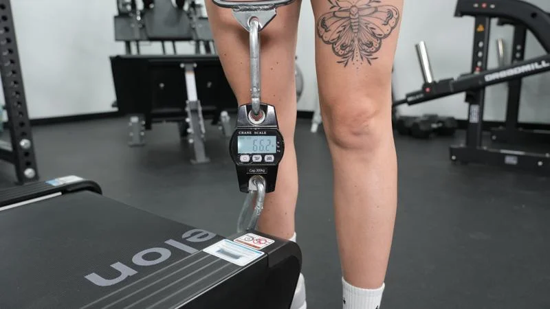 Checking the weight of one end of an Echelon Stride 8s Treadmill.