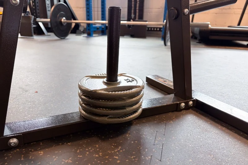 Weights stacked on the base of a Marcy Weight Plate Tree