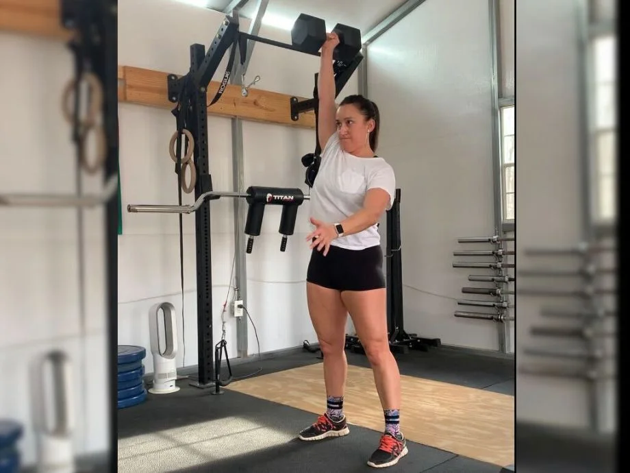 woman using living fit dumbbell