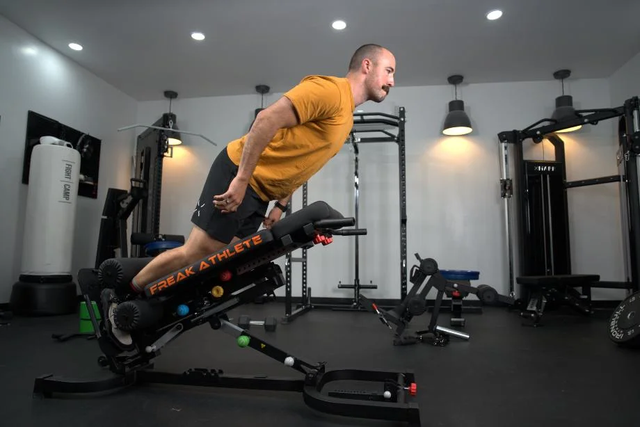 Man performing Nordic curls on the Freak Athlete Hyper Pro