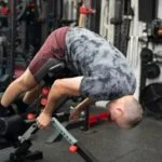 Person performs back extension on Freak Athlete GHD