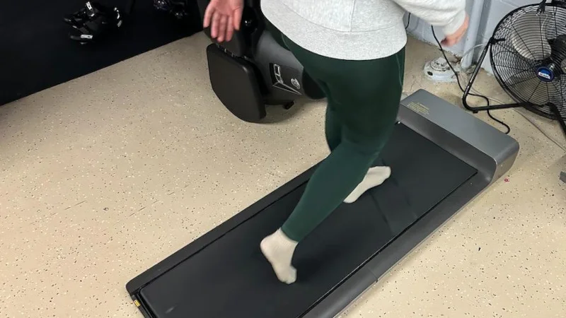 Woman Walking on a WalkingPad Treadmill