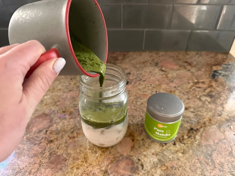 Our tester pouring a cup of Golde Pure Matcha