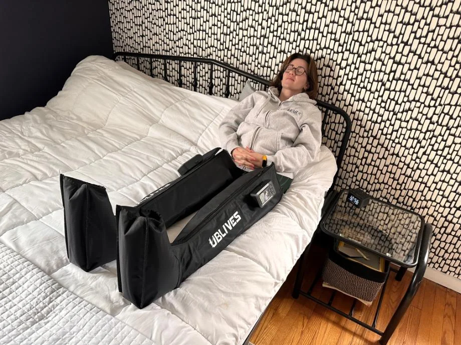 A person is shown resting with Ublives Compression Boots.
