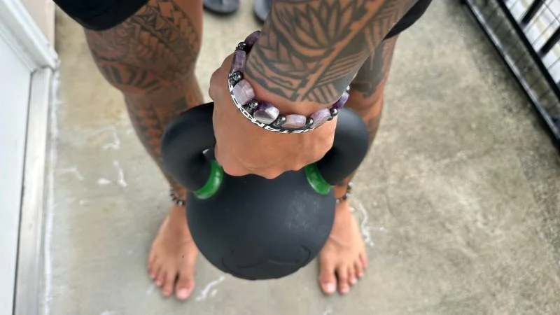 Our tester holding the Iron Bull Strength Kettlebell