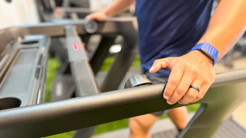 knob-on-the-handrail-of-the-peloton-tread-plus-treadmill A person's hand rests on the Handrail of the Peloton Tread+ treadmill