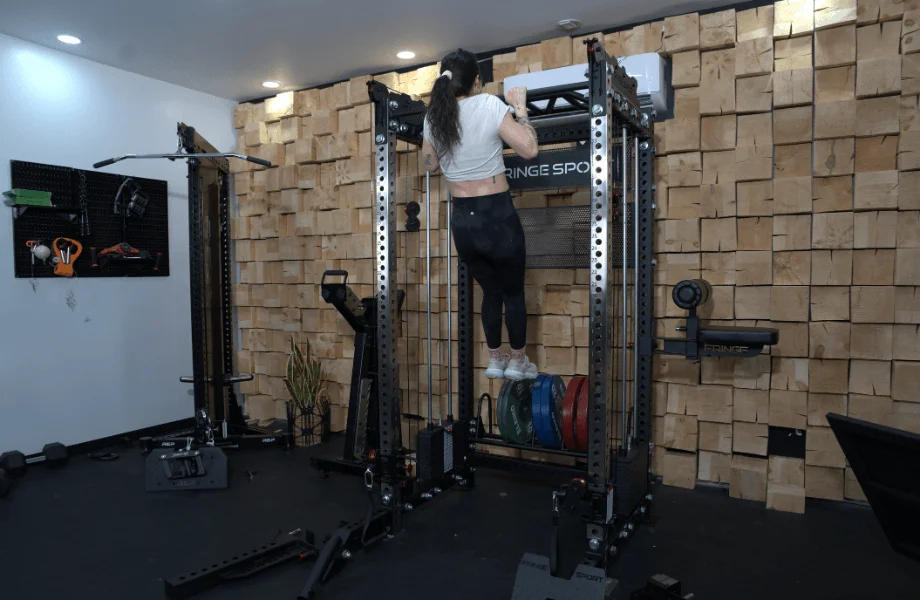 Our tester performing a pull-up inside the Fringe Sport Dane 2.0 functional trainer