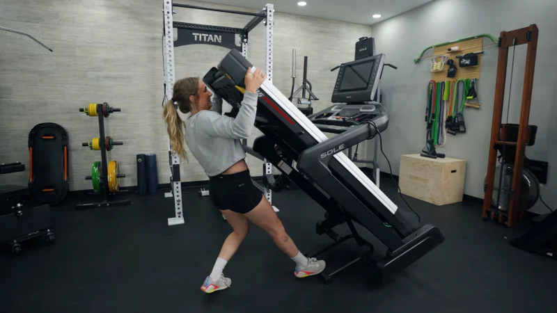 Our tester moving the Sole F85 Treadmill