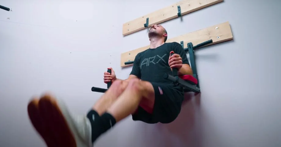 Coop doing leg raises on the OneTwoFit Power Tower