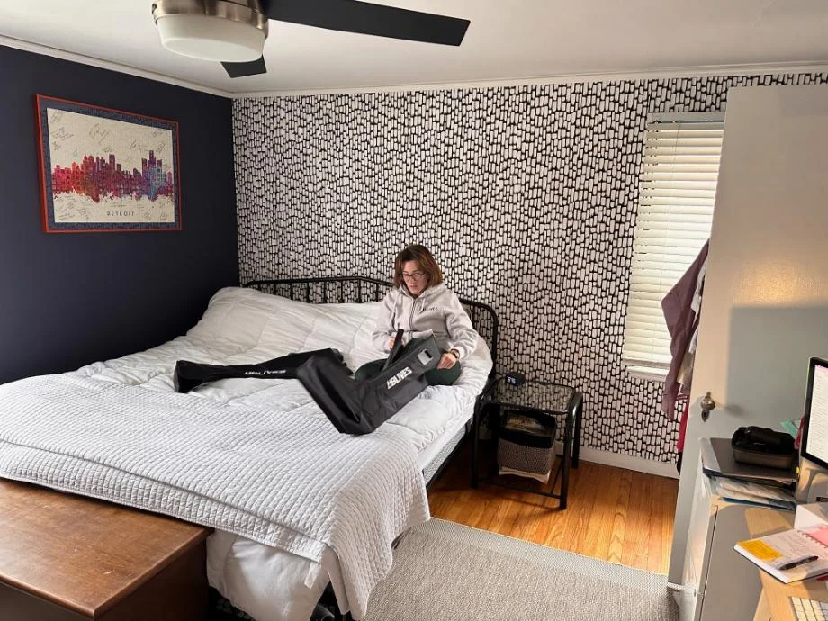 A person puts on Ublives Compression Boots