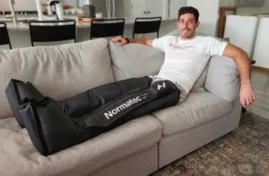 man wearing normatech elite recovery legs