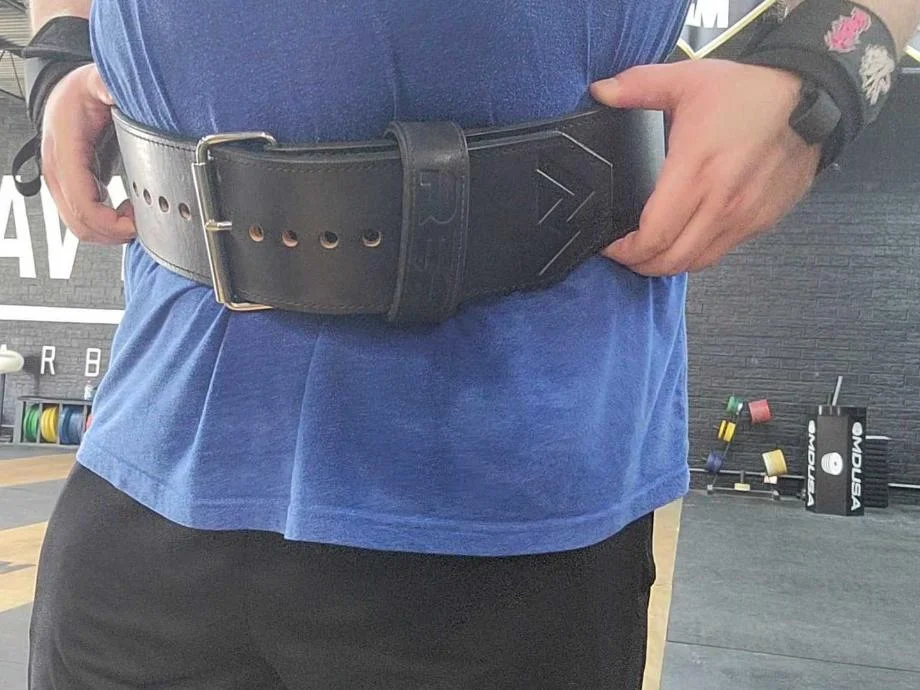 A man with the REP USA Premium Leather Lifting Belt wrapped around his torso.