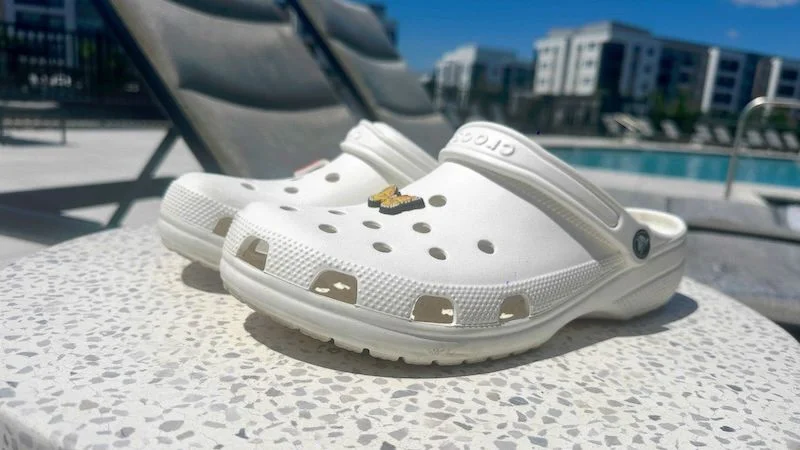 Side view of a pair of Croc Classic Clog recovery shoes.