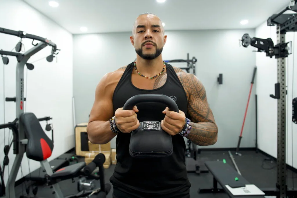 GGR writer Stephen Sheehan lifting an Ironmaster Quick-Lock adjustable kettlebell.