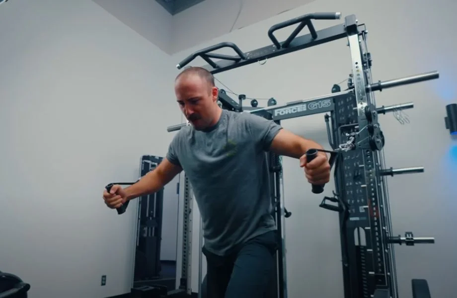 Man doing chest fly on Force USA G15