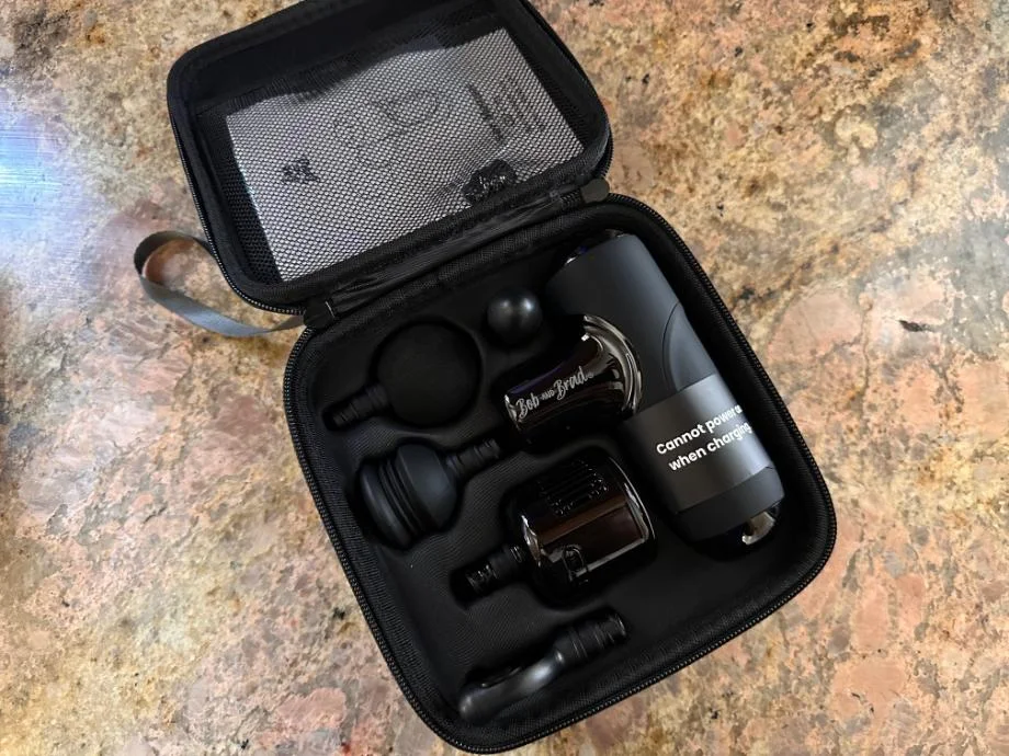 the carrying case holding the Bob and Brad Q2 Mini Massage Gun and its contents