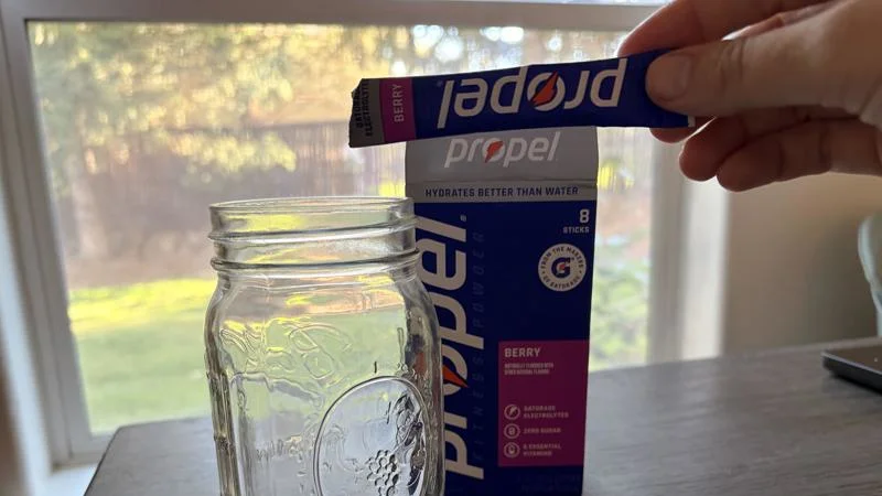 Our tester holds up a Propel Hydration Mix Packet