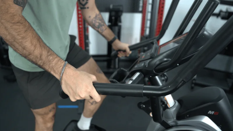 Our tester utilizing the lower moving handles on the Bowflex Max Trainer M6