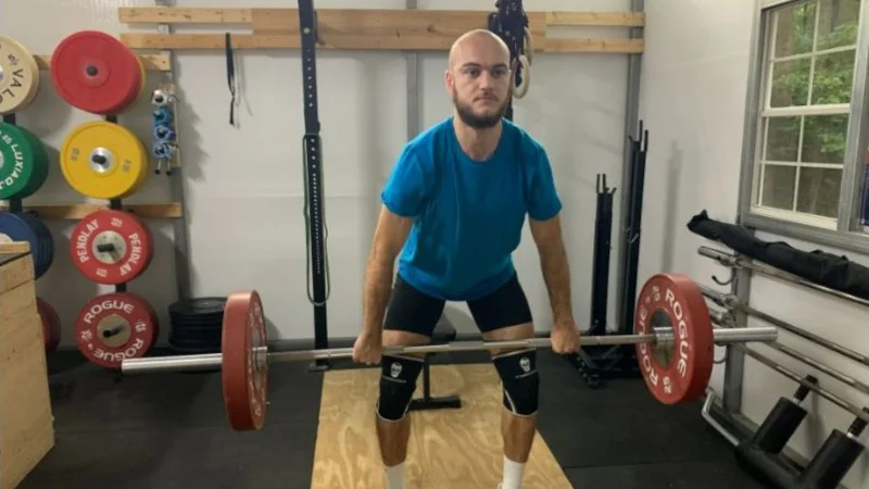 Our tester lifting weights with Gymreapers Knee Sleeves.