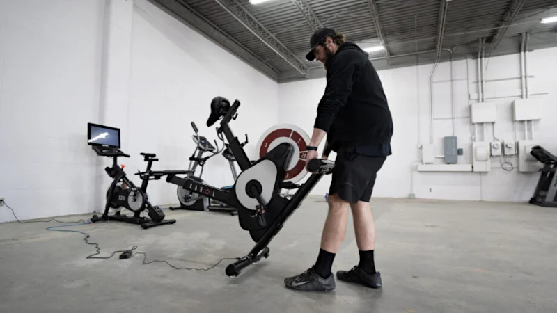 A person moving a CAROL bike.
