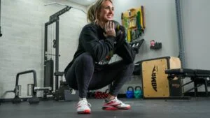 person squatting with reebok nano x4