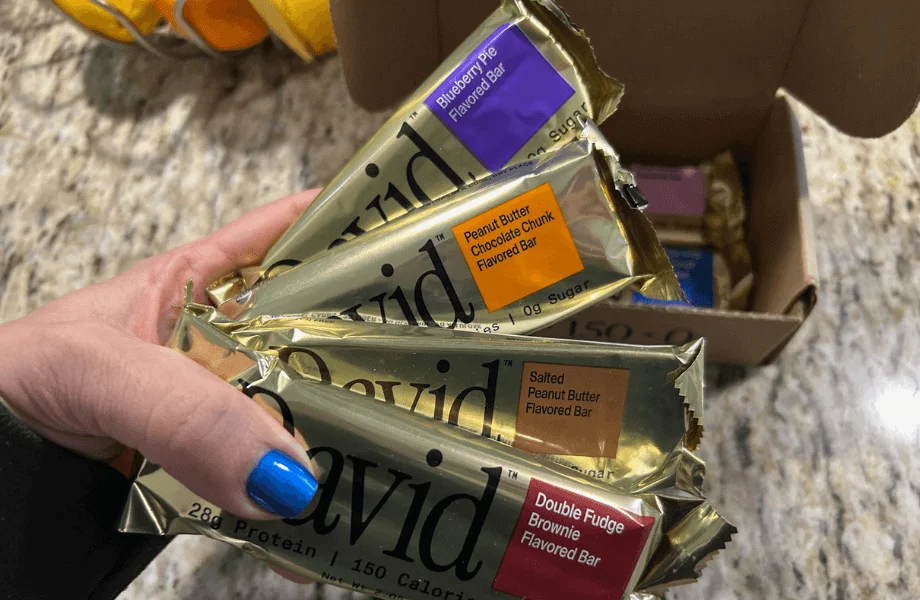 Our tester holding a bundle of David protein bars