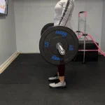 Our tester training with PRx Crumb Rubber Bumper Plates in their home gym