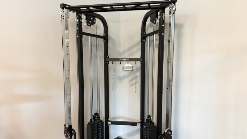 A view of how the Bells of Steel Functional Trainer fits into the corner of a garage gym