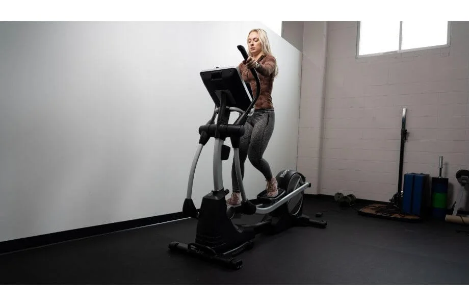 front view woman using NordicTrack SE9i