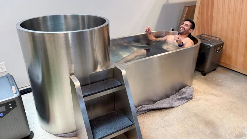 Our product tester soaking in the tub of a Polar Monkeys Contrast Edition Plunge.