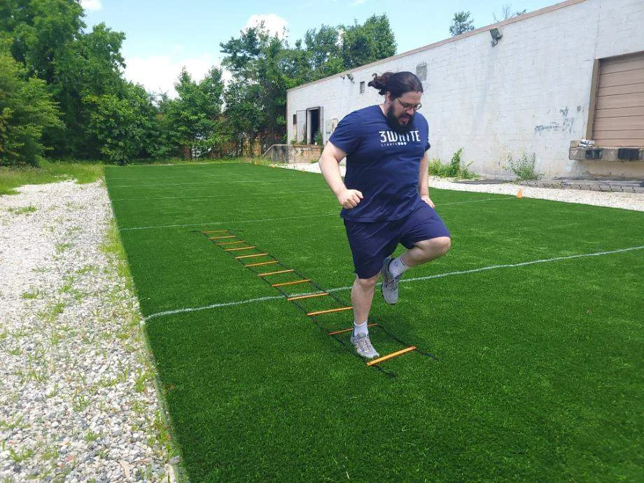 Olympian Caine Wilkes works on his footwork with the GHB Pro Agility Ladder.