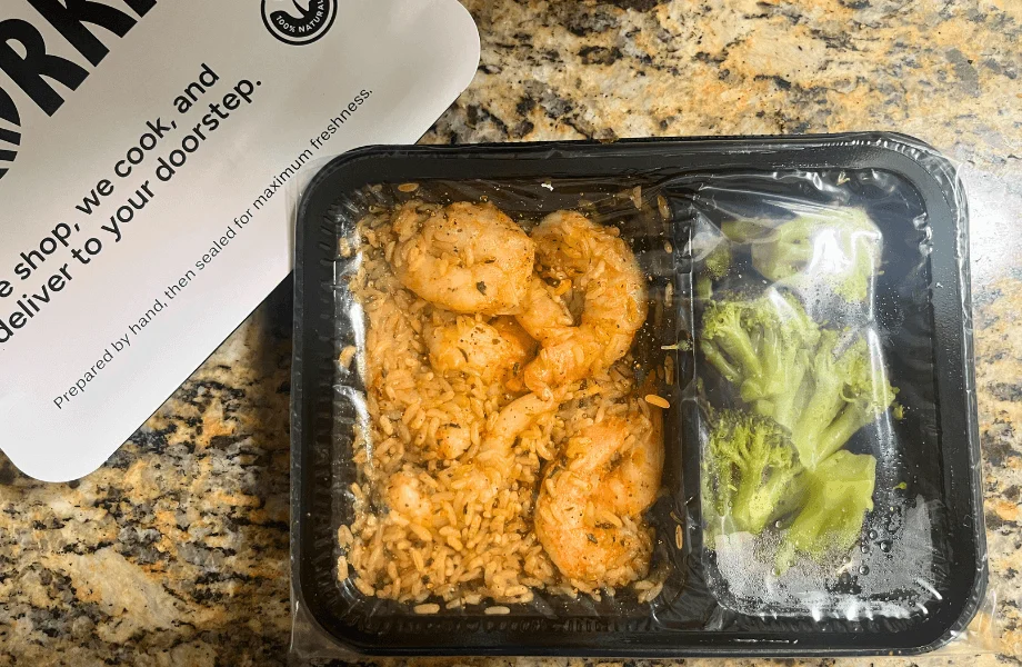An unopened shrimp, rice, and broccoli bowl from Forkful