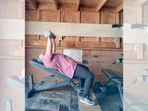 man pressing on dmoose adjustable bench