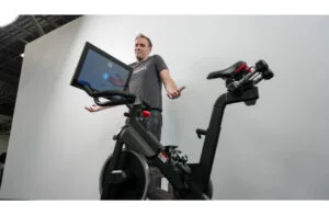 anthony shrugging next to pro form studio pro bike 22