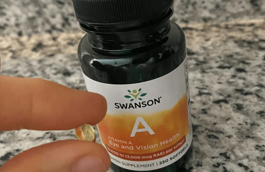 Our tester holding a single capsule of Swanson Vitamin A