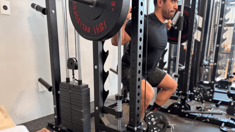 Our tester using the Smith machine barbell for back squats in the Major Fitness B52 Pro