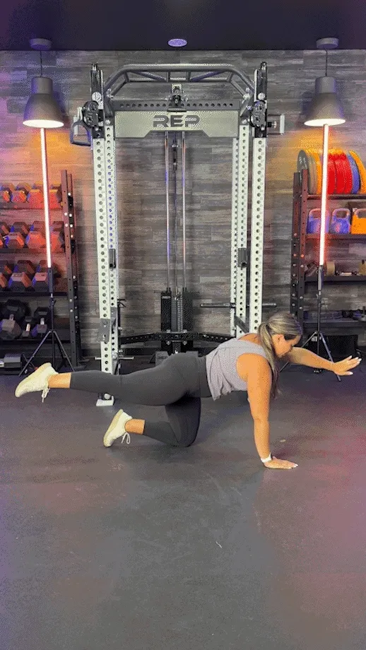 woman doing bird dog