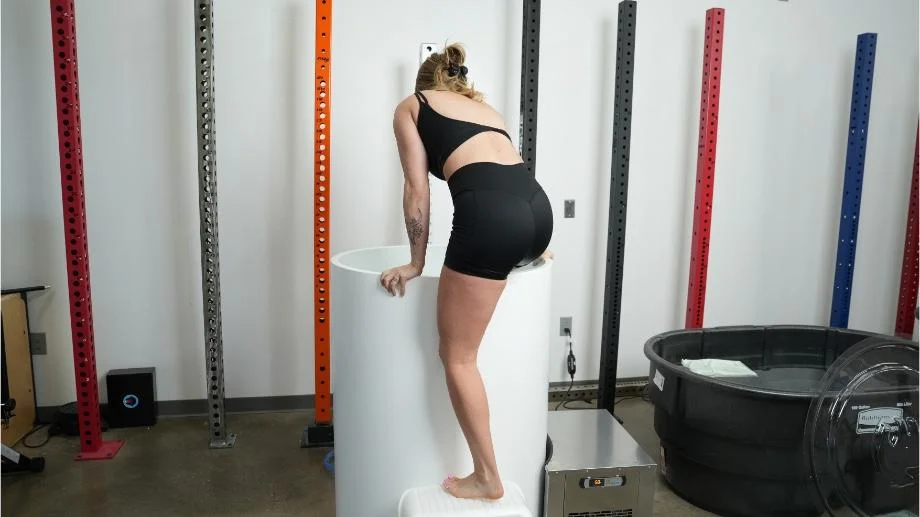 A woman climbs in to The Cold Life Plunge.