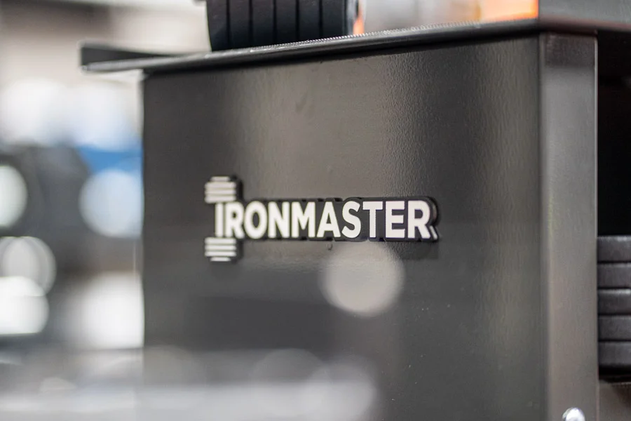 Ironmaster logo on the side of the stand for the weights