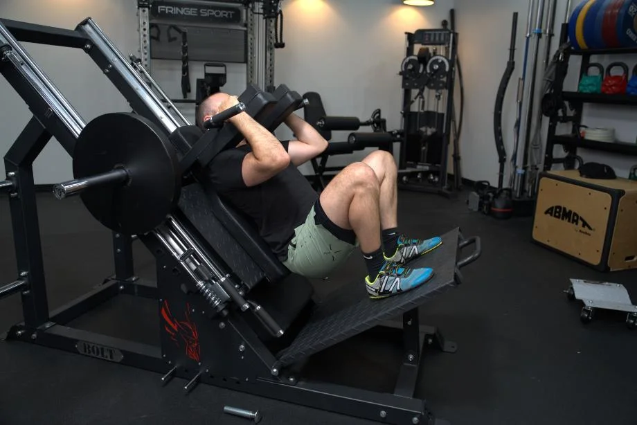 Coop squatting on a Bolt Fitness Hack Squat Leg Press