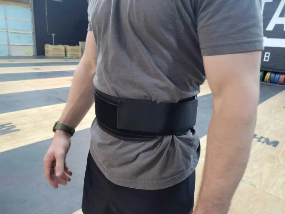 A person wearing the Warm Body Cold Mind Nylon Weightlifting Belt