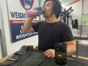 person drinking alpha lion supher human pre workout